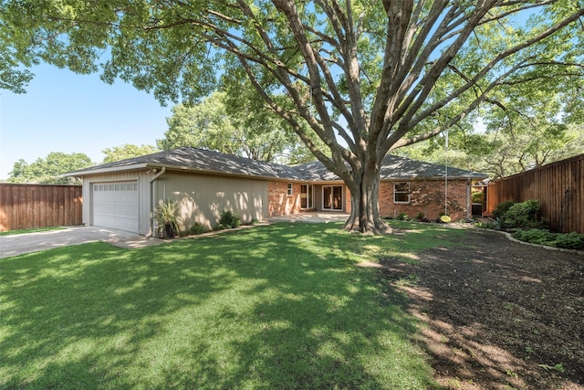 view of front facade featuring driveway, a garage, and brick siding