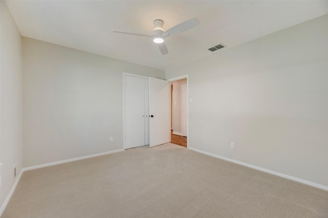 7324 Heathermore Dr, Dallas, TX 75248 - empty room featuring light carpet, ceiling fan, and baseboards