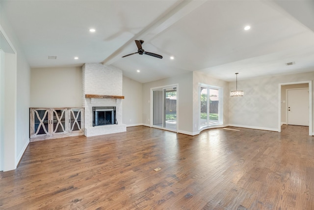 unfurnished living room featuring ceiling fan, a fireplace, dark wood-type flooring, baseboards, and recessed lighting