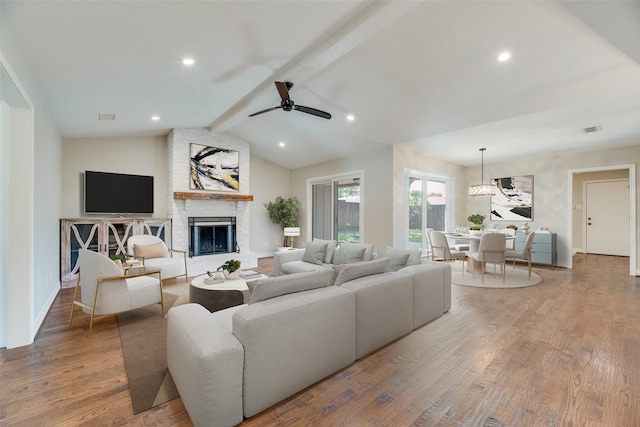 7324 Heathermore Dr, Dallas, TX 75248 - living room with a brick fireplace, a ceiling fan, wood finished floors, baseboards, and recessed lighting