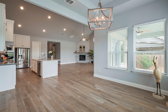 14312 Home Trl, Fort Worth, TX 76262 - kitchen with stainless steel appliances, open floor plan, a sink, baseboards, and a ceiling fan