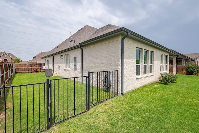 14312 Home Trl, Fort Worth, TX 76262 - view of home's exterior featuring central AC and a gate