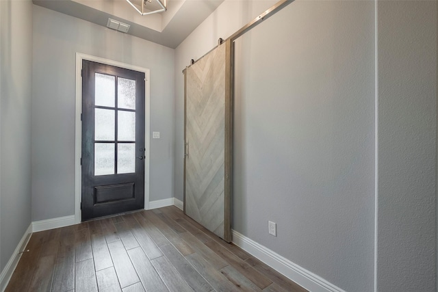 14312 Home Trl, Fort Worth, TX 76262 - entrance foyer with wood finished floors, baseboards, and a barn door