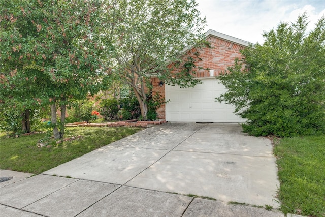 1727 Blacksmith Dr, Dallas, TX 75253 - view of property hidden behind natural elements featuring brick siding, driveway, an attached garage, and a front lawn