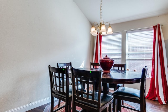 1727 Blacksmith Dr, Dallas, TX 75253 - dining room featuring a chandelier, dark wood-type flooring, baseboards, and vaulted ceiling