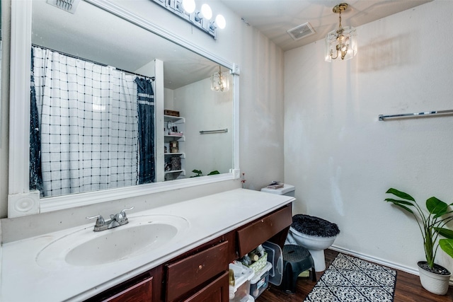 1727 Blacksmith Dr, Dallas, TX 75253 - full bathroom featuring a chandelier, vanity, and wood finished floors
