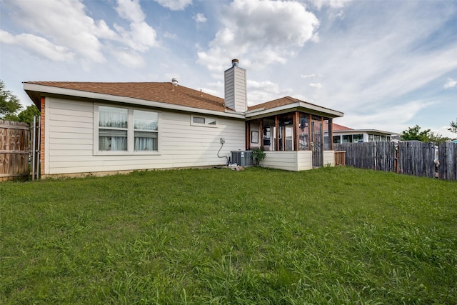 1727 Blacksmith Dr, Dallas, TX 75253 - rear view of property featuring a chimney and central AC