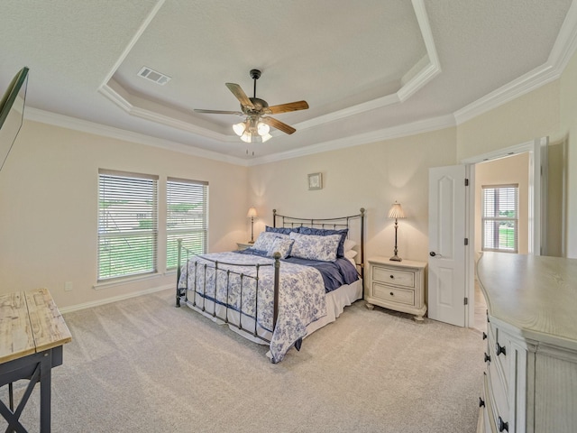 129 Spring Meadow Dr, Springtown, TX 76082 - bedroom with a tray ceiling, light carpet, ornamental molding, and a ceiling fan