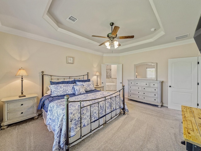 129 Spring Meadow Dr, Springtown, TX 76082 - carpeted bedroom featuring a raised ceiling, ornamental molding, ensuite bath, and a ceiling fan