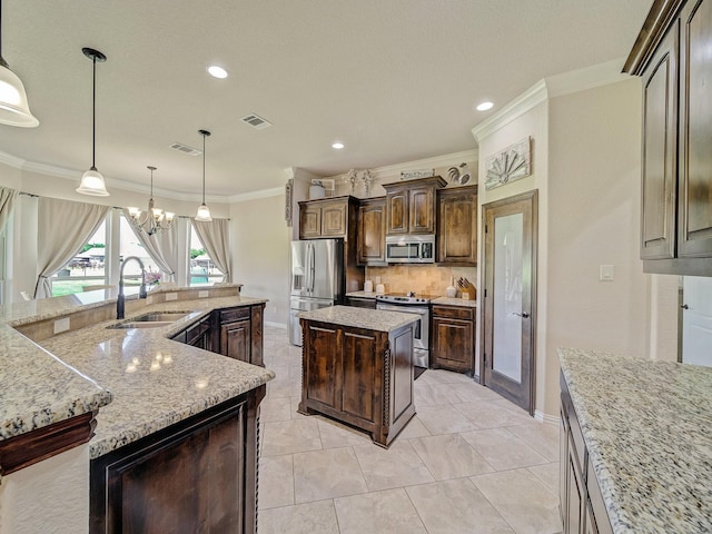 129 Spring Meadow Dr, Springtown, TX 76082 - kitchen featuring stainless steel appliances, a large island, a sink, crown molding, and backsplash
