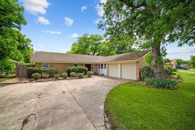 single story home with an attached garage, brick siding, driveway, and roof with shingles
