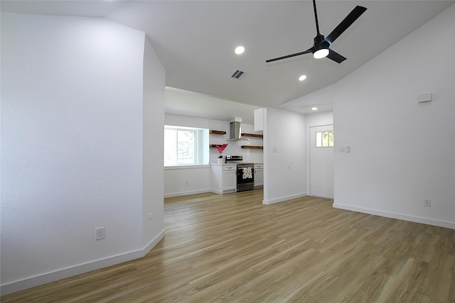 13308 Kempwood Ln, Dallas, TX 75253 - unfurnished living room with vaulted ceiling, ceiling fan, healthy amount of natural light, light wood-style flooring, and baseboards