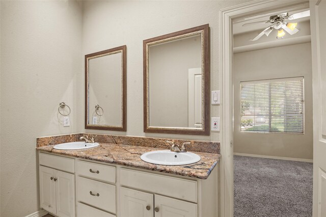 17 Wimbledon Ct, Heath, TX 75032 - full bathroom featuring double vanity, a ceiling fan, and baseboards