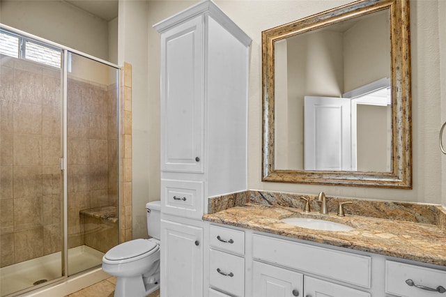17 Wimbledon Ct, Heath, TX 75032 - bathroom featuring toilet, vanity, and a stall shower