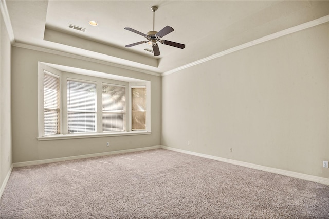 17 Wimbledon Ct, Heath, TX 75032 - spare room with a tray ceiling, ceiling fan, carpet floors, baseboards, and ornamental molding