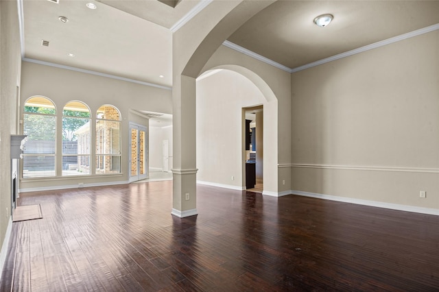 17 Wimbledon Ct, Heath, TX 75032 - unfurnished room with wood finished floors, baseboards, crown molding, arched walkways, and recessed lighting