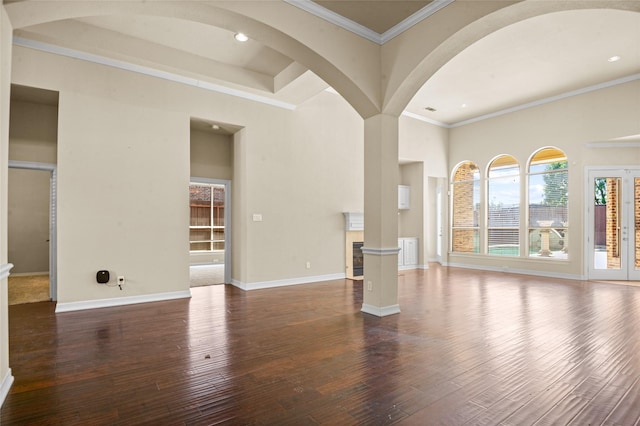 17 Wimbledon Ct, Heath, TX 75032 - unfurnished living room with dark wood-style floors, crown molding, decorative columns, baseboards, and recessed lighting