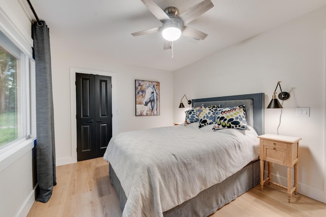 9 Southshore Cir, Star Harbor, TX 75148 - bedroom with light wood-style flooring, baseboards, and multiple windows