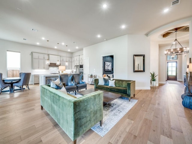 4208 Sunrise Ln, Celina, TX 75078 - living room featuring a chandelier, light wood-type flooring, baseboards, and recessed lighting