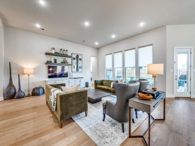 4208 Sunrise Ln, Celina, TX 75078 - living room with light wood-type flooring, healthy amount of natural light, recessed lighting, and baseboards