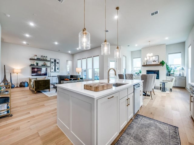 4208 Sunrise Ln, Celina, TX 75078 - kitchen with a sink, open floor plan, plenty of natural light, light wood-style floors, and recessed lighting
