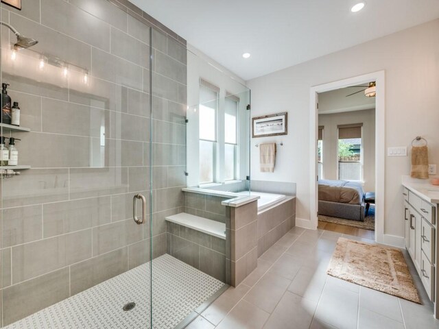 4208 Sunrise Ln, Celina, TX 75078 - bathroom with a stall shower, connected bathroom, tile patterned floors, a bath, and vanity