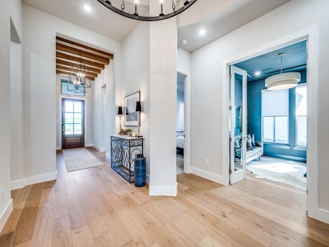 4208 Sunrise Ln, Celina, TX 75078 - foyer featuring a chandelier, wood finished floors, baseboards, and beamed ceiling
