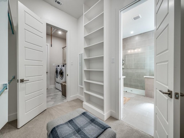 4208 Sunrise Ln, Celina, TX 75078 - walk in closet featuring washing machine and clothes dryer and light carpet