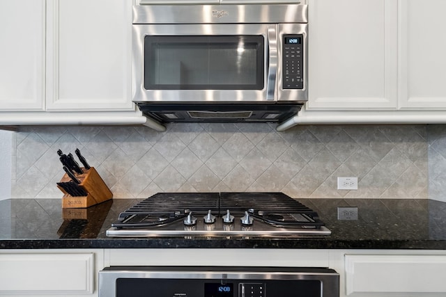 804 Countryside Way, Little Elm, TX 76227 - kitchen with appliances with stainless steel finishes, white cabinetry, backsplash, and dark stone countertops