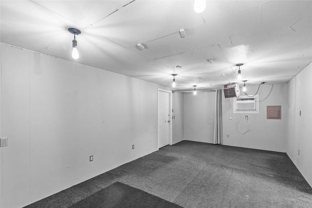 252 Brenda Dr, Shreveport, LA 71115 - finished below grade area with dark carpet, an AC wall unit, and electric panel