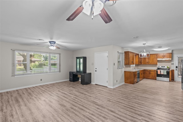 252 Brenda Dr, Shreveport, LA 71115 - unfurnished living room featuring ceiling fan, light wood-style floors, a sink, and baseboards