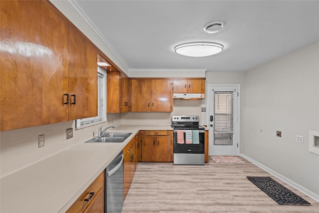 252 Brenda Dr, Shreveport, LA 71115 - kitchen featuring stainless steel appliances, a sink, under cabinet range hood, light wood-type flooring, and brown cabinets