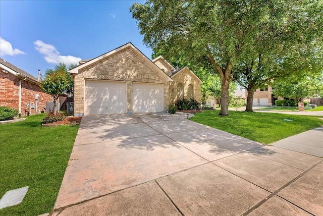 2652 Waterway Dr, Grand Prairie, TX 75054 - view of front of house featuring brick siding, a garage, concrete driveway, and a front yard