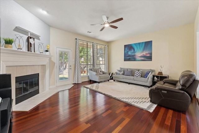2652 Waterway Dr, Grand Prairie, TX 75054 - living room featuring ceiling fan, wood finished floors, and a tiled fireplace