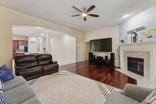 2652 Waterway Dr, Grand Prairie, TX 75054 - living area with wood finished floors, arched walkways, ceiling fan, recessed lighting, and a fireplace