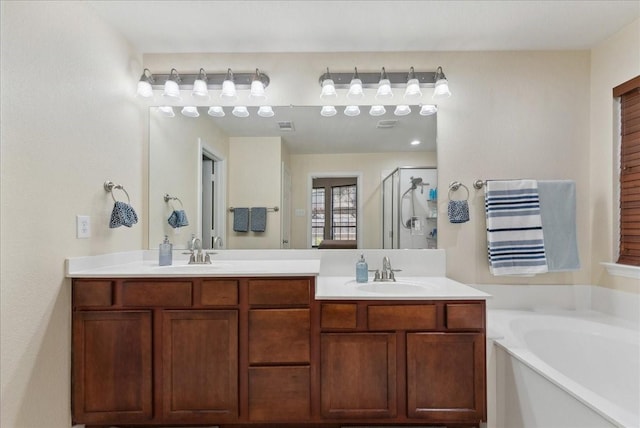 2652 Waterway Dr, Grand Prairie, TX 75054 - bathroom with a shower stall, a garden tub, and double vanity