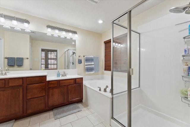 2652 Waterway Dr, Grand Prairie, TX 75054 - bathroom featuring a shower stall, tile patterned floors, a bath, double vanity, and recessed lighting