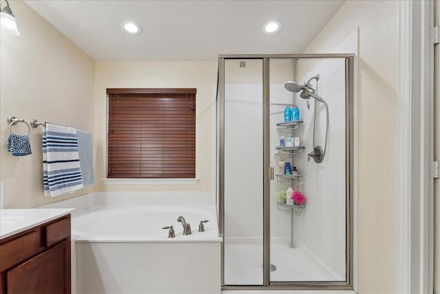 2652 Waterway Dr, Grand Prairie, TX 75054 - full bathroom featuring a stall shower, a bath, vanity, and recessed lighting