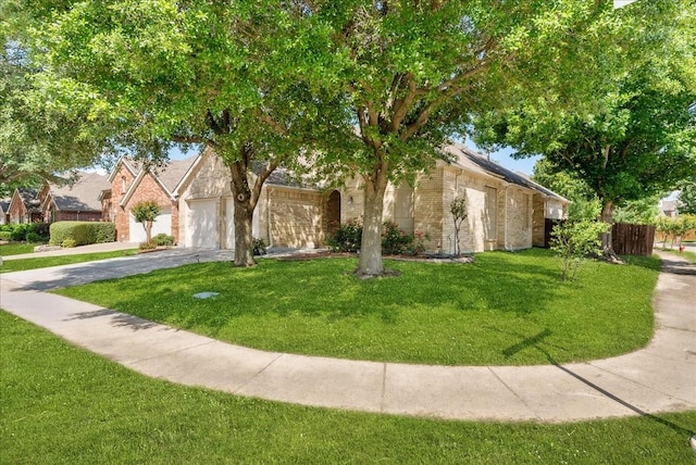 2652 Waterway Dr, Grand Prairie, TX 75054 - view of front facade with driveway, brick siding, and an attached garage
