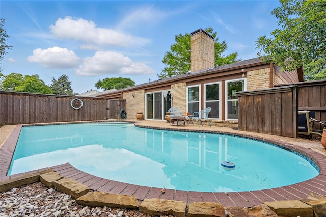 view of pool with fence
