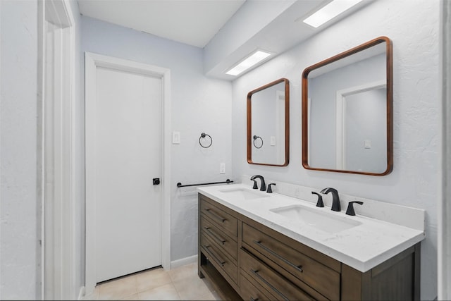 bathroom featuring tile patterned floors and double vanity