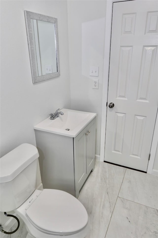 bathroom with toilet and vanity
