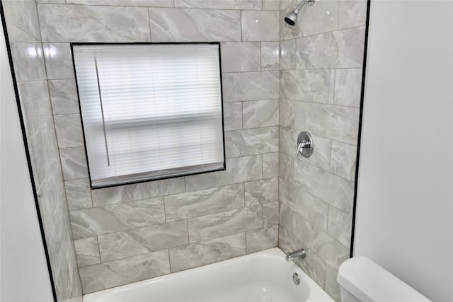 full bathroom featuring toilet and bathing tub / shower combination