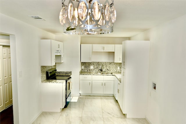 kitchen with electric stove, a sink, light marble finish flooring, tasteful backsplash, and white cabinetry