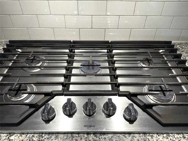 3340 Sorghum Way, Mckinney, TX 75071 - detailed view of stainless steel gas cooktop and tasteful backsplash