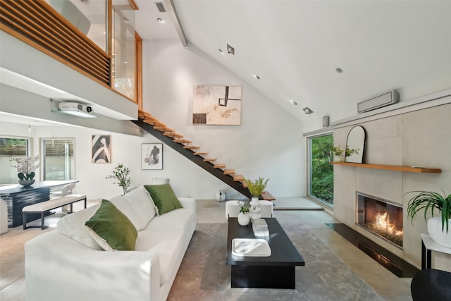 957 Easton Pl, Dallas, TX 75218 - living room with high vaulted ceiling, a fireplace with flush hearth, stairs, tile patterned flooring, and beamed ceiling