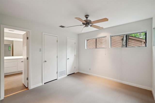 957 Easton Pl, Dallas, TX 75218 - unfurnished bedroom featuring light colored carpet, baseboards, a ceiling fan, and connected bathroom