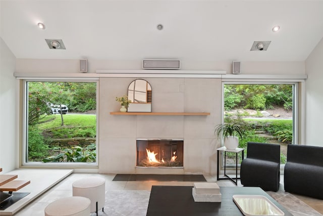 957 Easton Pl, Dallas, TX 75218 - living area with a tile fireplace, tile patterned floors, and lofted ceiling