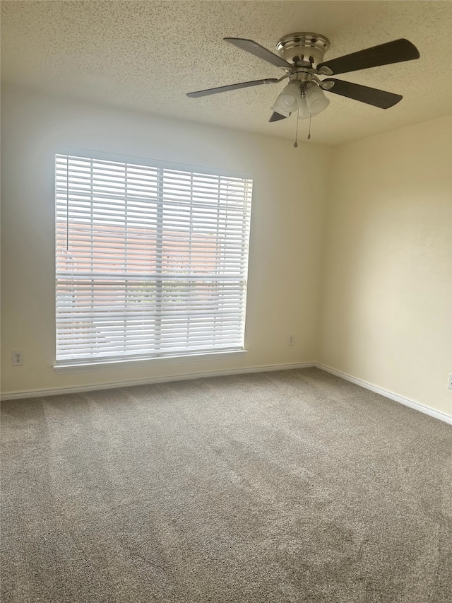12921 Abrams Rd Unit 407, Dallas, TX 75243 - carpeted spare room with a ceiling fan, a textured ceiling, and baseboards