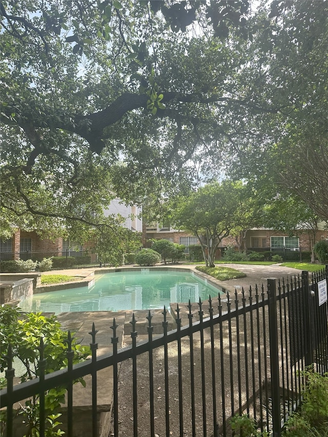 12921 Abrams Rd Unit 407, Dallas, TX 75243 - view of pool featuring fence